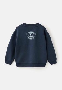 Sweat-shirt bleu marine en tissu mélangé coton, avec un logo PAW PATROL brodé dans le dos, et des poignets et un col côtelés.
