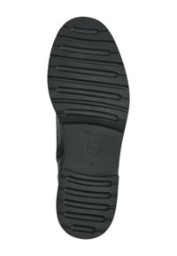 Suela de zapato de goma negra con surcos y crestas texturizadas, marcada con "Tamaris" y la talla "37" en el lateral. Presenta un patrón elevado.