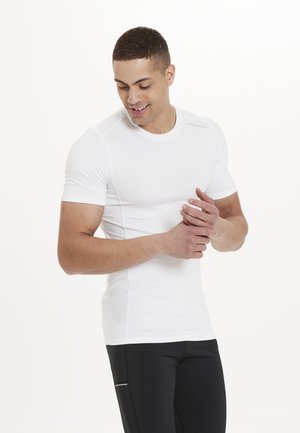 White short-sleeve athletic shirt with a fitted design, made from moisture-wicking fabric, featuring textured side panels and a crew neck.