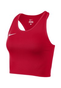 Top corto sportivo rosso Nike con design a racerback, realizzato in tessuto liscio, con un piccolo logo bianco nell'area sinistra del petto.