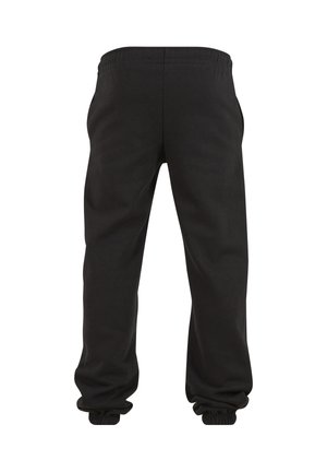 Fekete elasztikus derékpántú melegítőnadrág, elasztikus mandzsettákkal, hátulról fehér háttéren.