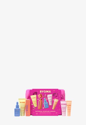 Das Hautpflege-Geschenkset enthält sieben Röhrchen und Flaschen in leuchtenden Farben: blau, pink, orange und gelb, und wird in einer pinkfarbenen Box mit auffälligen Grafiken präsentiert.