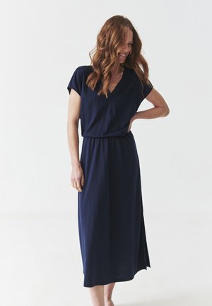 Navy blue, knee-length dress with short sleeves and a V-neck. Features a cinched waist and subtle textured detailing along the neckline.