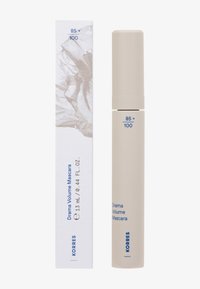 Korres Drama Volume Mascara-rör och förpackning, beige förpackning med blå text, 13 ml volym, minimalistisk design med bergsgrafik på lådan.