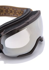 Braune Skibrille mit transparentem Zeiss-Glas, ausgestattet mit einem strukturierten Riemen und einem weichen Schaumstofffutter für Komfort. Verstellbares und ergonomisches Design.
