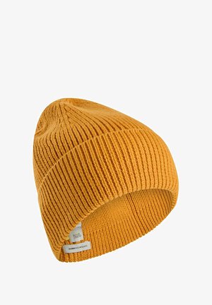 Yellow knitted beanie hat with ribbed texture and a folded cuff. Features a fabric tag with text on the inside. Soft acrylic material.