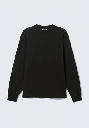 Black long-sleeve cotton t-shirt featuring a round neckline and ribbed cuffs, with a straight hem and minimal stitching details.