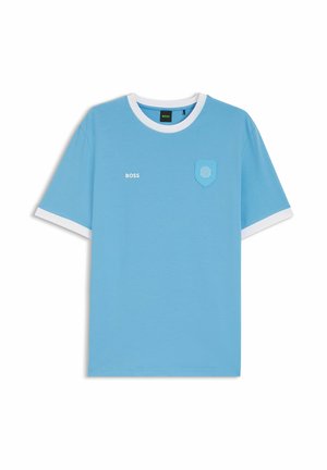 Light blue short-sleeve T-shirt with white collar and cuffs, small "BOSS" text on the left chest, and a stitched emblem on the right chest.