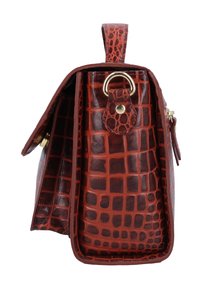 Brown handbag with a crocodile skin pattern, gold ring detail, and side strap, shown from the side on a white background.