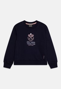 Sweat-shirt bleu marine avec poignets côtelés, col rond et logo de club de tennis brodé en rose représentant des raquettes croisées et une balle.