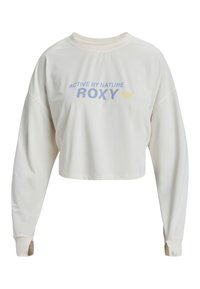 Kermainen, pitkähihainen lyhythihainen collegepaita, jossa on pyöreä kaula-aukko. Paidassa on sinisellä ja keltaisella painettuna "ACTIVE BY NATURE" ja "ROXY".