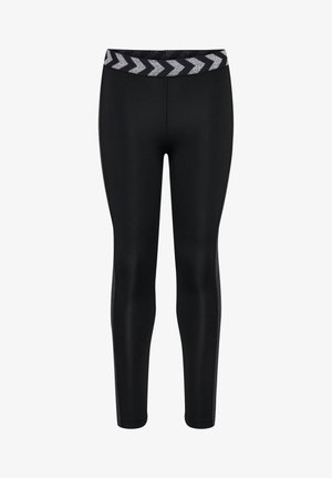 Sorte leggings lavet af strækbart materiale med en tætsiddende pasform. Har en chevron-mønstret talje i sølv og teksturerede sider.