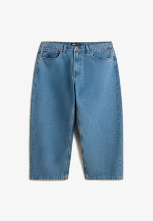 Light blue denim jeans with a relaxed, wide-leg fit. Features five pockets, belt loops, and contrasting orange stitching. Smooth texture.