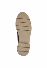 Shoe sole in beige rubber with horizontal grooves and textured pattern for grip. Features rounded toe and flexible design.
