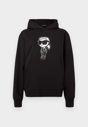 Black hoodie featuring a cartoon character graphic in white, wearing sunglasses and a suit, with "KARL LAGERFELD" text in red below.