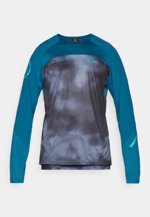 Langærmet cykeltrøje i teal og mørkegrå med en struktureret overflade, der har et logo, rund halsudskæring og en lynlås lomme på ærmet.