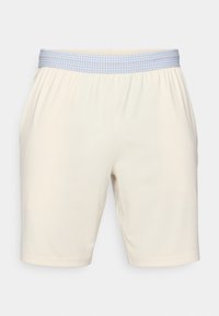 Pantaloni corti color crema con una vita elastica, caratterizzati da un motivo a scacchi azzurri. Tessuto morbido, taglio al ginocchio, orlo semplice.