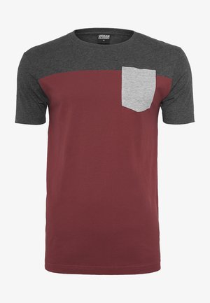 Short-sleeve T-shirt featuring a maroon body, dark gray sleeves, and a light gray pocket. Made from soft, breathable fabric with a crew neckline.
