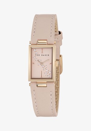 Rektangulär klocka med ram i roséguld, mjuk beige läderrem och en ljusrosa urtavla med kristalldetaljer och svarta timmarkörer.