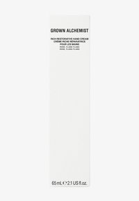 Białe pionowe opakowanie kremu do rąk Grown Alchemist, z wyraźnym czarnym tekstem z przodu, z informacjami o produkcie i objętości na dole.