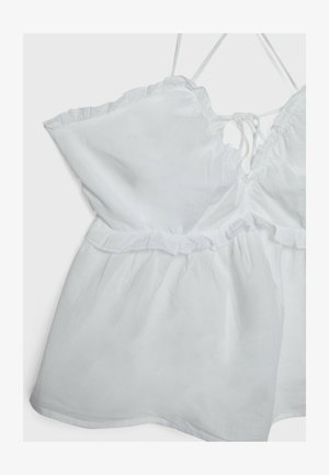 Top bianco senza maniche con orlo arricciato, spalline regolabili e vita cinchata. Realizzato in tessuto leggero con una texture morbida.