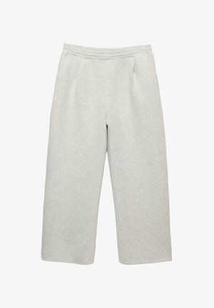 Svetlé šedé široké tepláky vyrobené z mäkkej tkaniny. Majú elastický pás a dve predné vrecká. Bez viditeľných vzorov alebo kovových prvkov.