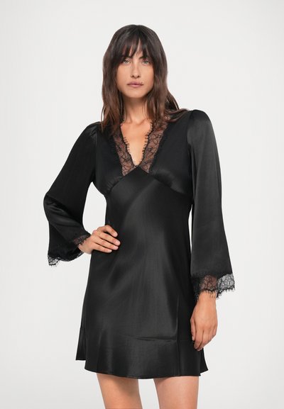 Black satin dress with a V-neck, lace trim around the neckline, and flared long sleeves featuring lace accents at the cuffs.