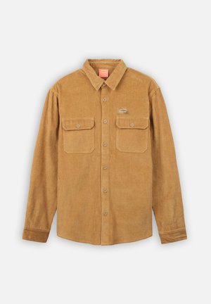 Chemise en velours côtelé marron avec des manches longues, fermeture à boutons, deux poches poitrine et logo Oxbow. Tissu texturé avec des nervures verticales.