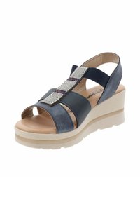 Sandali con zeppa in materiale sintetico blu navy, design aperto sulla punta, cinturini elasticizzati e un accento di strass sul davanti. Suola beige.