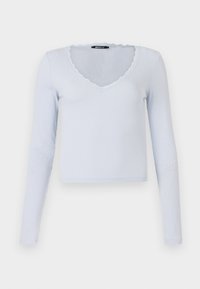 Light blue long-sleeve top with a ribbed texture, V-neckline, and scalloped lace trim around the neckline and sleeves.