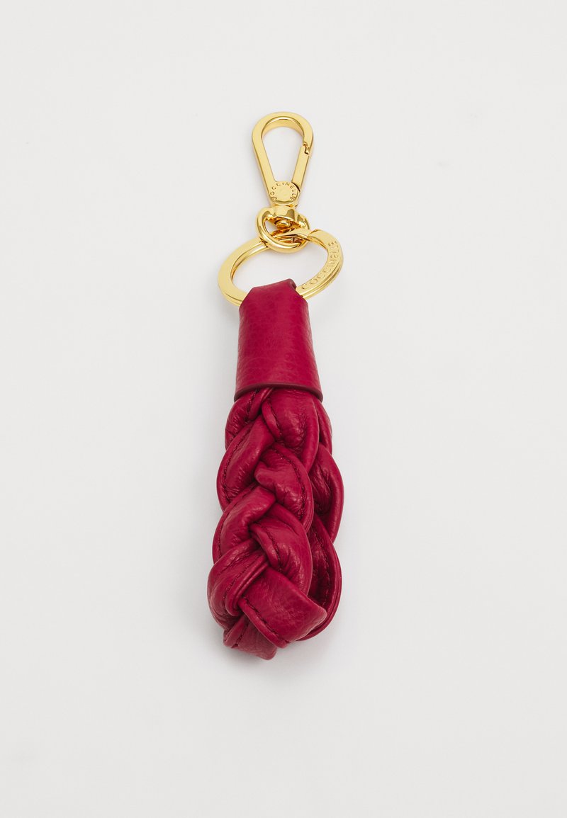 Porte-clés en cuir de couleur rouge profond, avec un design tressé, une texture lisse, et un clip et un anneau en métal doré pour l'attache.