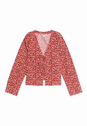 Gilet à motifs floraux rouges avec des manches longues, un décolleté en V et une fermeture à boutons sur le devant. Tissu doux avec une légère texture.