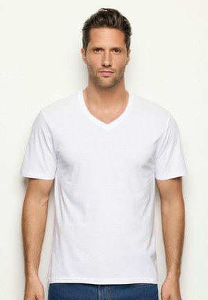 T-shirt en coton blanc avec un col en V, des manches courtes et une texture lisse. Design simple, adapté à un usage décontracté.