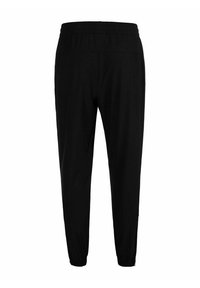 Zwarte sportbroek met een elastische tailleband, taps toelopende enkels, een minimalistisch ontwerp en zachte, lichte stof voor comfort.