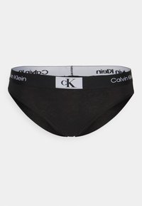Svart bomullsbikini-type undertøy med bred elastisk linning med hvit "Calvin Klein" merkevare og logo-lapp.
