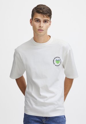 White cotton t-shirt with a round neckline and short sleeves, featuring a printed green heart logo and text on the left chest.