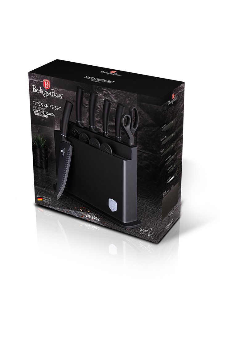 Zestaw noży składający się z 11 elementów w eleganckim czarnym opakowaniu, zawierający noże, nożyczki i deski do krojenia, z nowoczesnym stojakiem do ekspozycji i przechowywania.