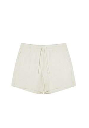 Light beige shorts made of soft fabric, featuring an elastic waistband with a drawstring, side pockets, and a relaxed fit.
