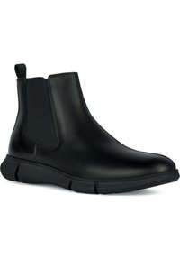 Bottes Chelsea en cuir noir avec panneaux latéraux élastiques, bout arrondi et semelle en caoutchouc texturée pour adhérence et flexibilité.