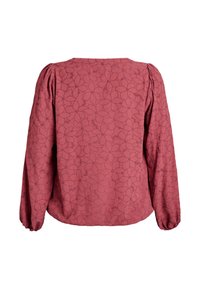 Långärmad blus i rosafärg med subtilt blommönster och bärmönster, samlade puffärmar, och elastiska mudd. Visad bakifrån.