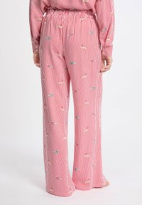 Gestreepte rode pyjamabroek met een elastische tailleband, voorzien van kleine hondenmotieven in verschillende kleuren, van zachte stof en een losse pasvorm.
