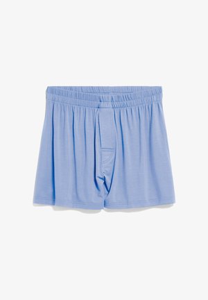 Light blue cotton boxers with an elastic waistband, featuring a front fly, loose fit, and smooth texture. No visible patterns or accents.