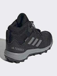 Black hiking boots with a textured upper, featuring gray accents, a rubber sole with traction, and a secure lace-up system.