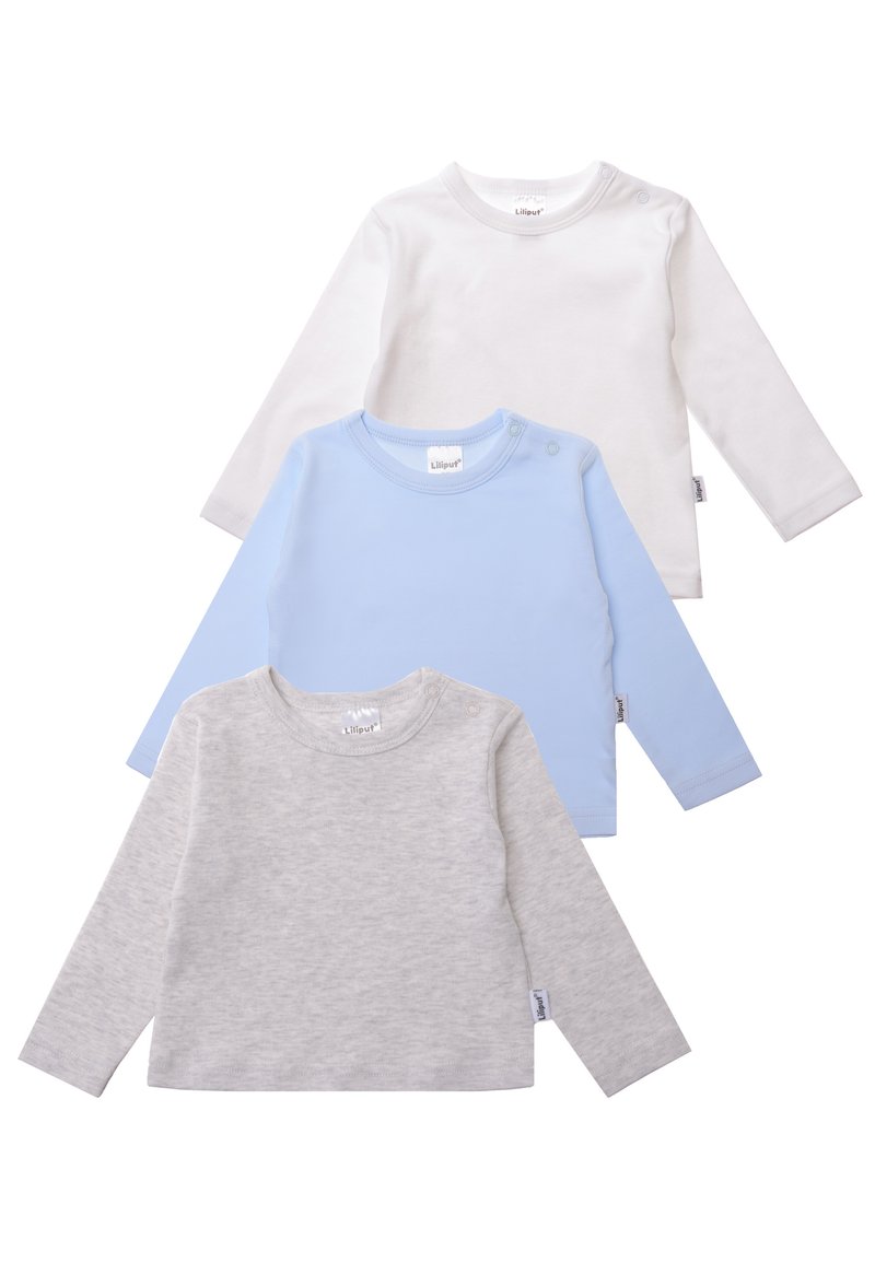 Three long-sleeve shirts in white, light blue, and light gray cotton. Each has a round neckline and the blue shirt features snap buttons on the shoulder.