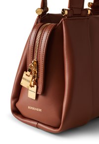 Brown leather handbag with gold hardware, featuring a zip closure, logo detail, and structured shape. Soft texture with a subtle sheen.