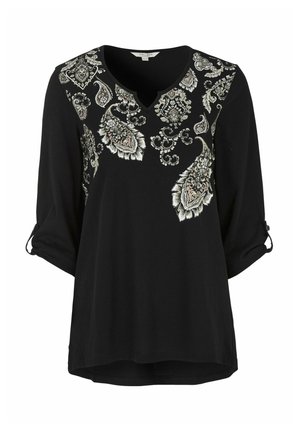 Schwarzes Shirt mit V-Ausschnitt und Dreiviertelärmeln, versehen mit aufwendiger weißer und goldener Paisley-Stickerei auf der Vorderseite. Weicher, leichter Stoff.