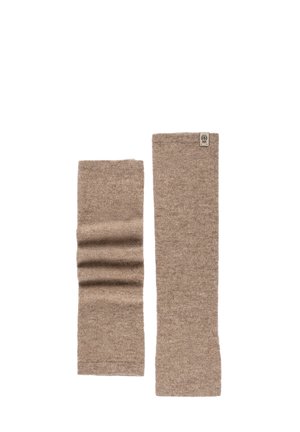 Pair of beige knitted leg warmers with ribbed detailing on one and a small fabric label on the other, shown flat on white background.