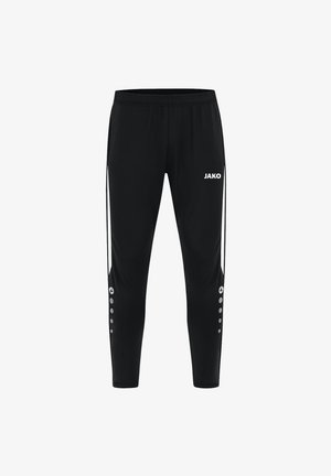 Pantaloni sportivi neri con design affusolato, vita elastica, logo "JAKO" bianco e strisce laterali bianche con dettagli circolari.