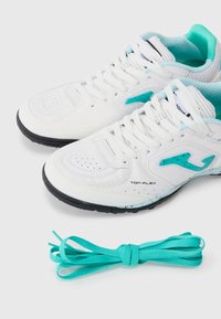 White athletic shoes with turquoise accents and perforated detailing, accompanied by matching turquoise shoelaces. Features a black outsole.