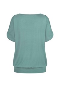 Haut à manches courtes teal en tissu doux, avec un col rond et un ourlet froncé, présentant une texture lisse et un design décontracté.